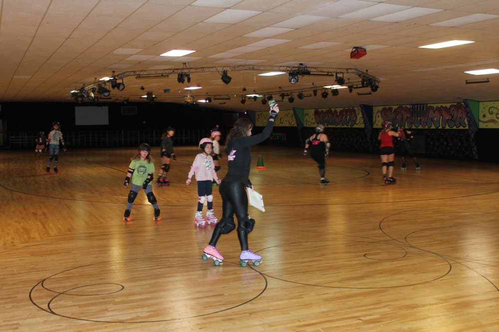 Brenda Holley (center) founded South Side Roller Derby in 2006. (Sierra Rozen/Community Impact Newspaper)