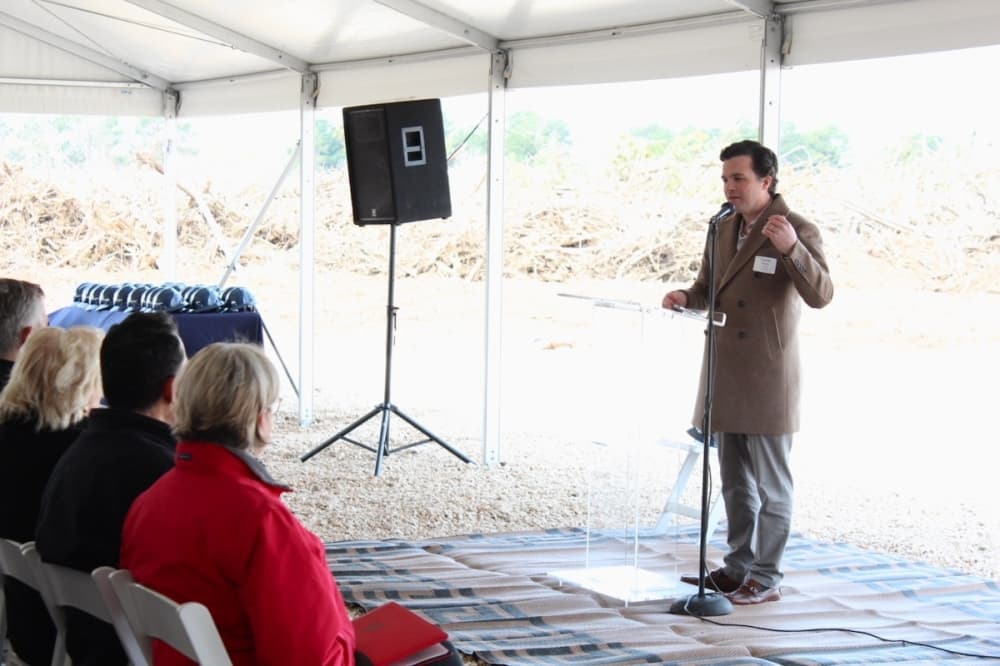 Charlie Meyer, president and co-owner of Lovett Industrial, spoke to attendees at the March 9 groundbreaking. (Anna Lotz/Community Impact Newspaper)