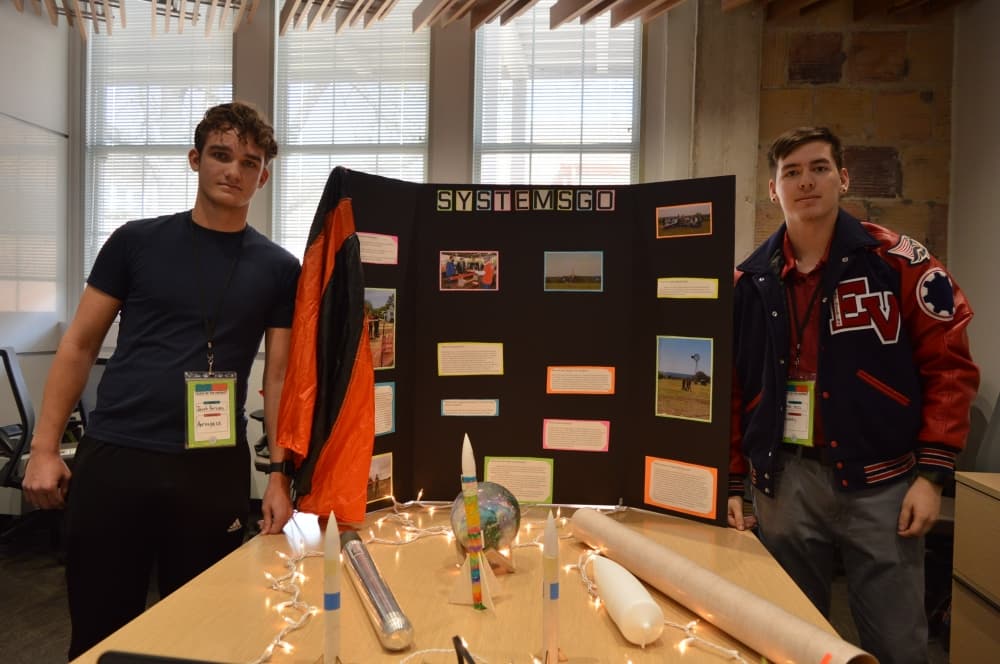From left: GISD Aerospace Engineering students Jake Parsons and Ethan Neil stand with their project. (Hunter Terrell/Community Impact Newspaper)