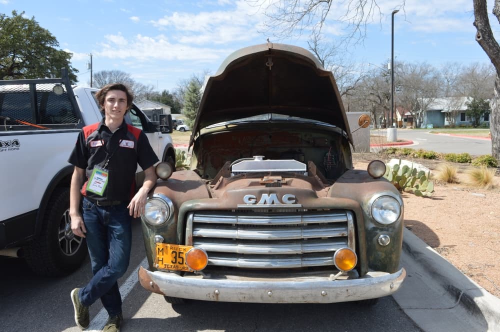 East View senior Timothy Granberry stands next to a truck he rebuilt in a month. (Hunter Terrell/Community Impact Newspaper)