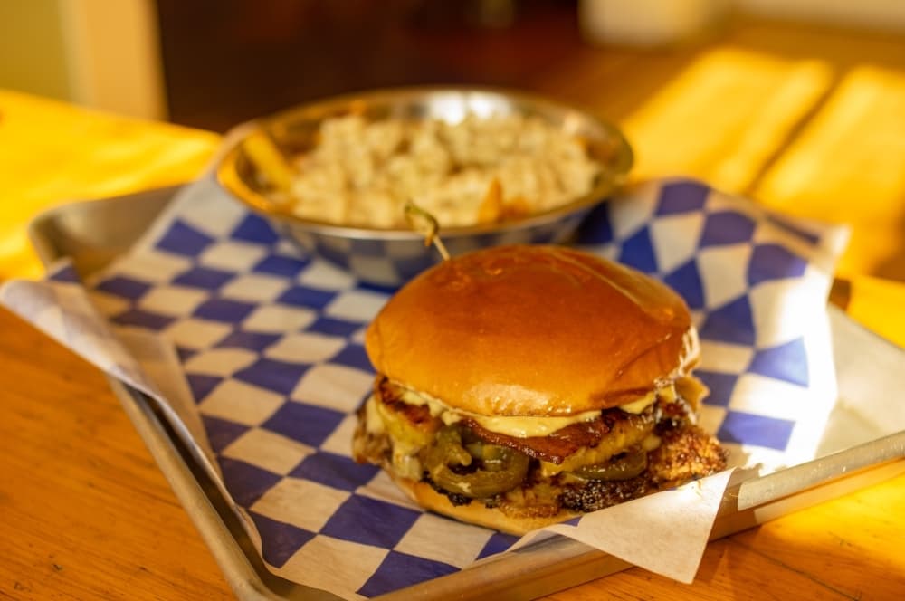 Smashed patties are served with selection of libations at Tin Top Burgers & Beer
