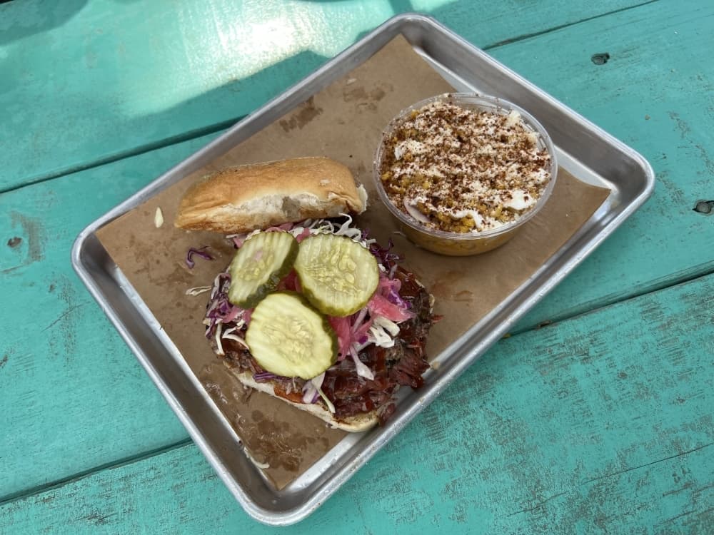 The Chopped Brisket Sando comes with a side of elote street corn from Louie's Craft BBQ.