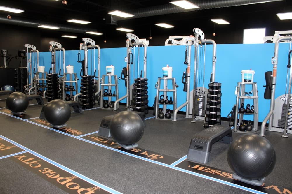 Outlaw FitCamp franchises feature stylish branding including names of outlaws and outlaw towns on the workout ‘cells.' (Karen Chaney/ Community Impact Newspaper)