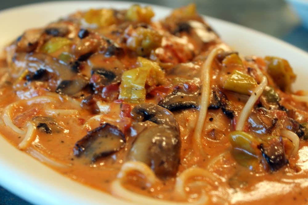 Chicken Venecia ($12.95) comes with sautéed chicken breast, mushrooms and peperoncini in a pink sauce. (Karen Chaney/ Community Impact Newspaper)