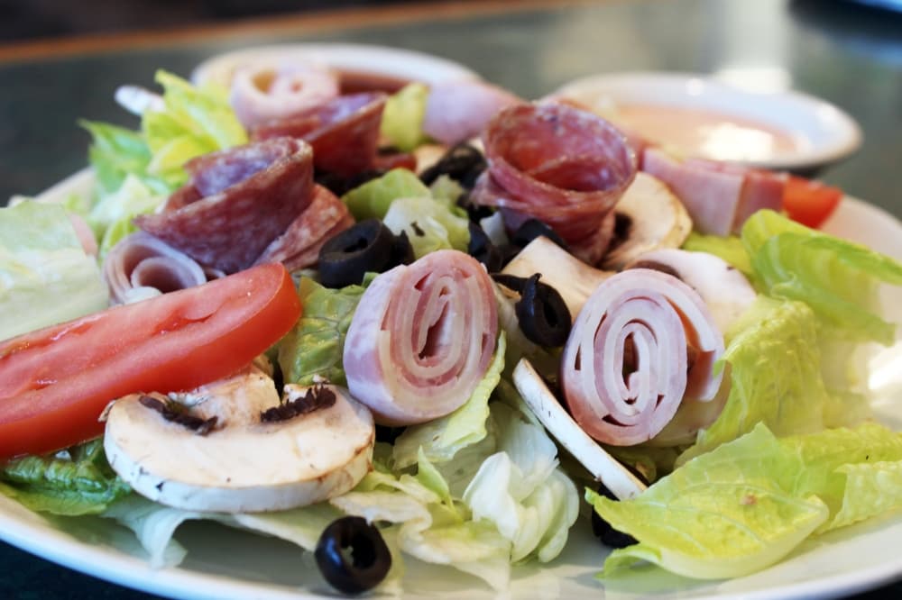 Antipasto chef salad ($9.95) includes ham, salami, provolone, mushrooms, black olives and mozzarella. (Karen Chaney/ Community Impact Newspaper)