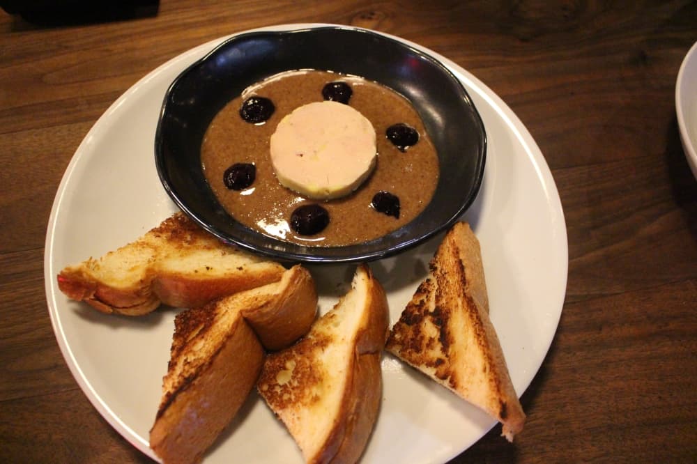 The Foie Gras Torchon PB&J ($17): Mixed berry jam and pecan butter are served with foie gras on brioche toast. (Sofia Gonzalez/Community Impact Newspaper)