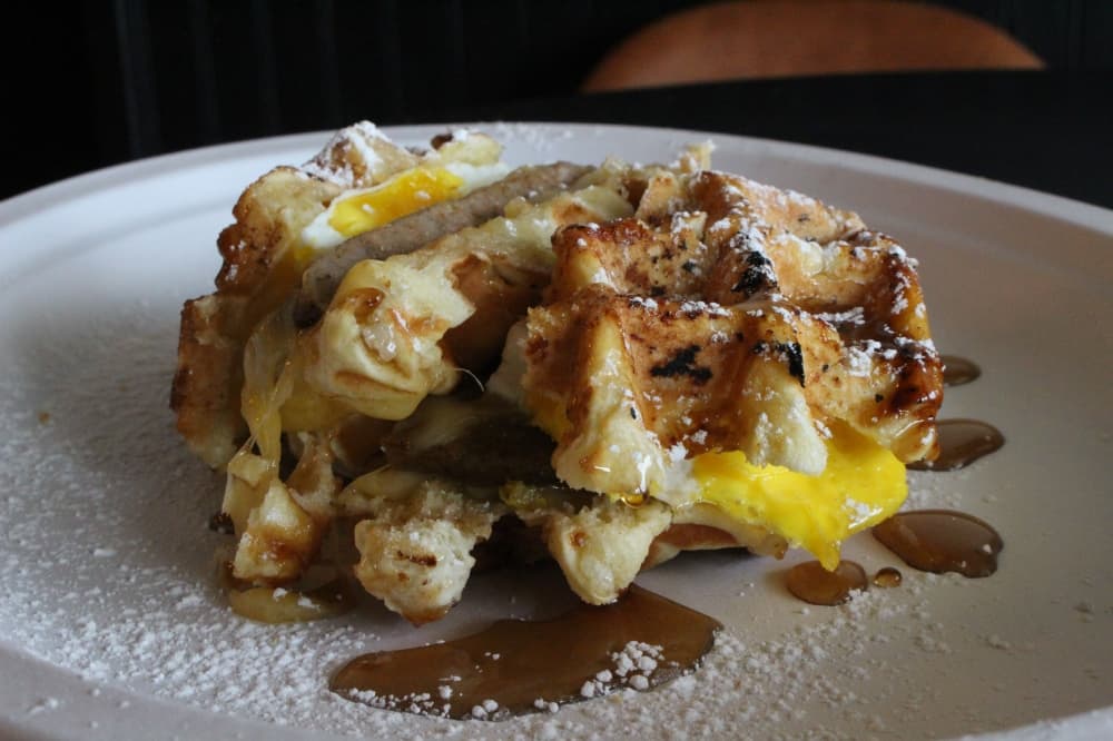 The Houstonian ($9.50) consists of spicy sausage, white American cheese and an over-hard egg. (Andrew Christman/Community Impact Newspaper)