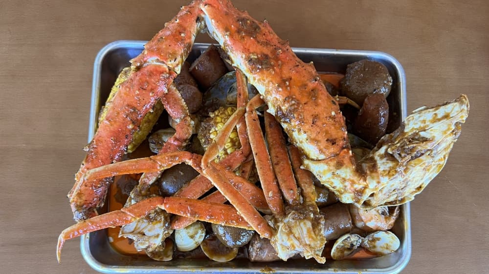 The Kracken is a boil bag with king crab, snow crab, shrimp, clams, green mussels, sausage, corn and potatoes. ($105) (Grace Dickens/Community Impact Newspaper)