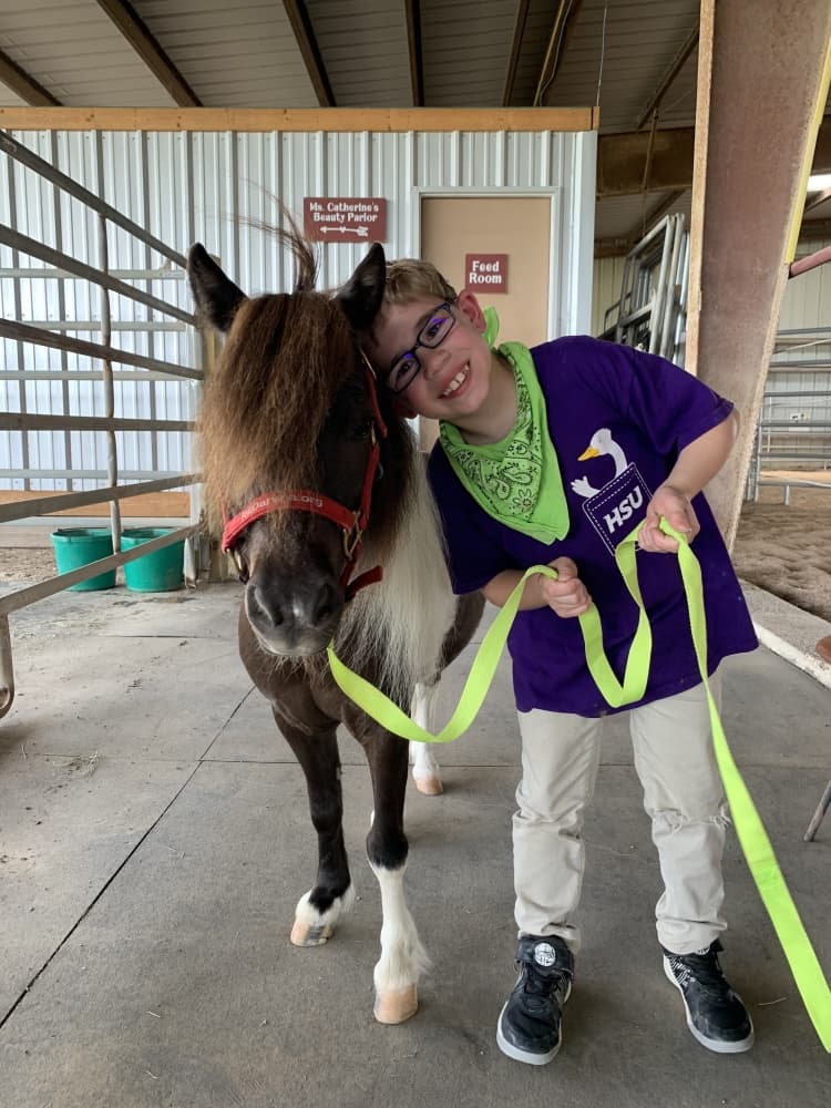 RED Arena Summer Horse Camp welcomes kids with disabilities along with their siblings and friends to enjoy horseback riding, mini horses, crafts, and gross and fine motor activities. (Courtesy RED Arena Summer Horse Camp)