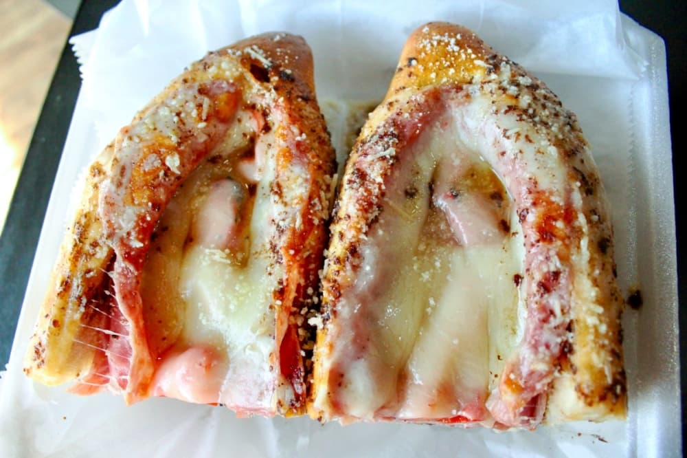 The Rocky ($11.95): This hot carnegie comprises capicola, provolone cheese, olive smear, red peppers, tomatoes and sub oil. (Emily Lincke/Community Impact Newspaper)