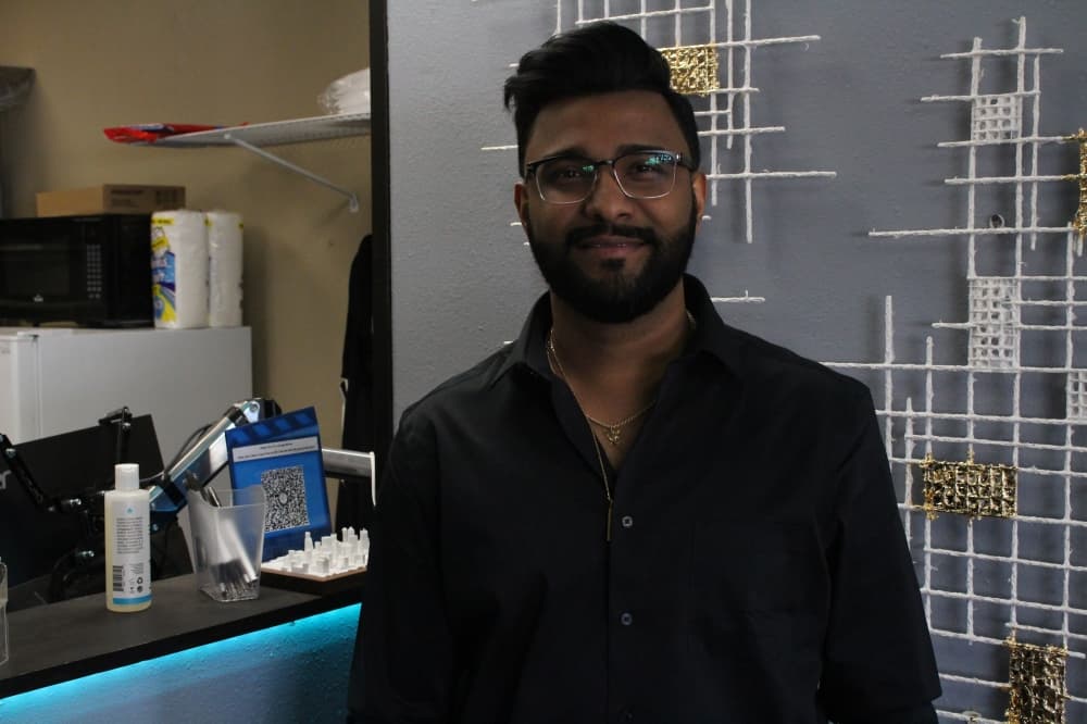 Melwin Zachariah recently became the owner of Boxes to Go after nearly two years of working for the company. (Jackson King/Community Impact Newspaper)