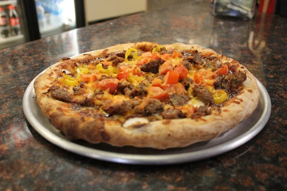 Pulled-pork pizza ($12.15) features pork toppings. (Cynthia Zelaya/Community Impact Newspaper)