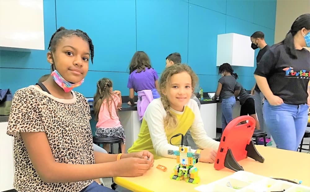 Robotics themed camps let kids build and test new robots every day. Tablets called ATOM help campers figure out code and provide instruction. (Courtesy Funtastik Labs)