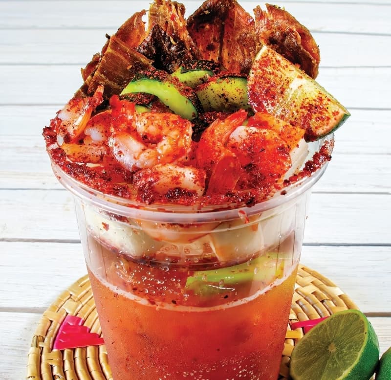 Chelada Camaron ($9) is a spicy beer cocktail with shrimp and limes. (Courtesy Lone Star Cheladas)