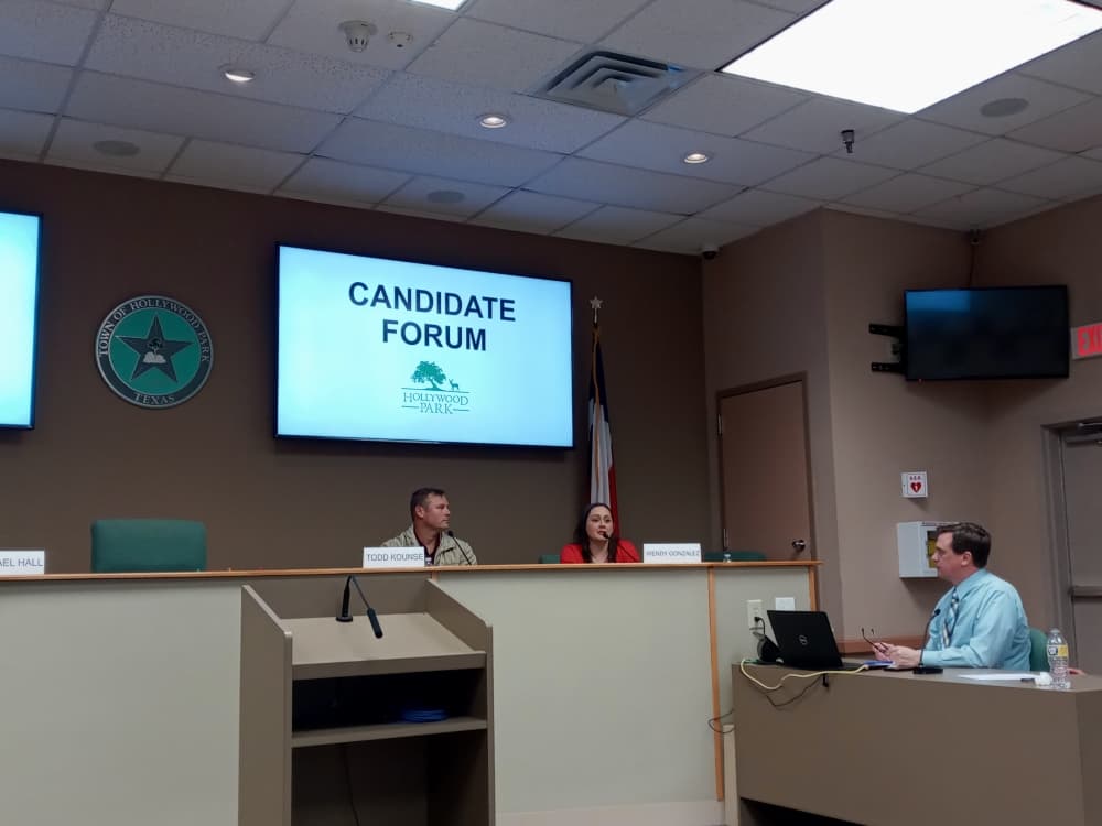 Hollywood Park City Council Place 4 applicant Wendy Gonzalez speaks as council Place 2 contestant Tood Kounse listens during an April 4 Hollywood Park candidate forum at City Hall. (Edmond Ortiz/Community Impact Newspaper)
