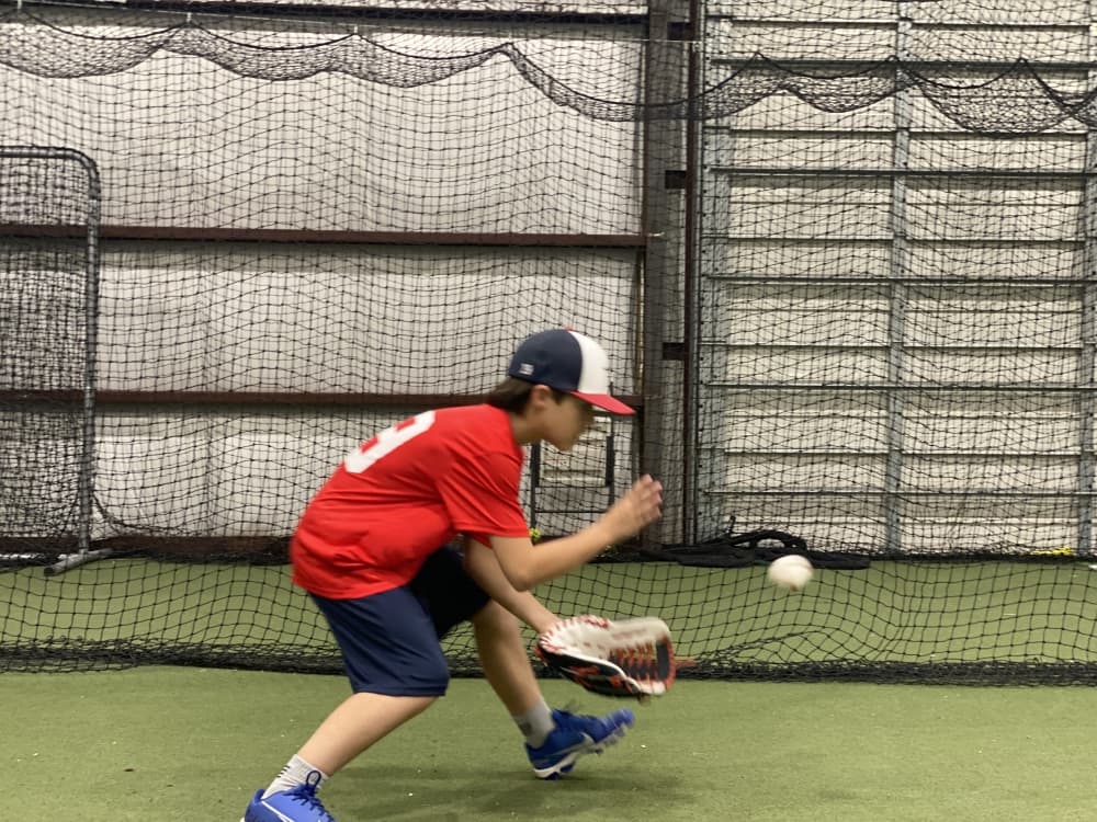 
A player fields a grounder during a training session.
