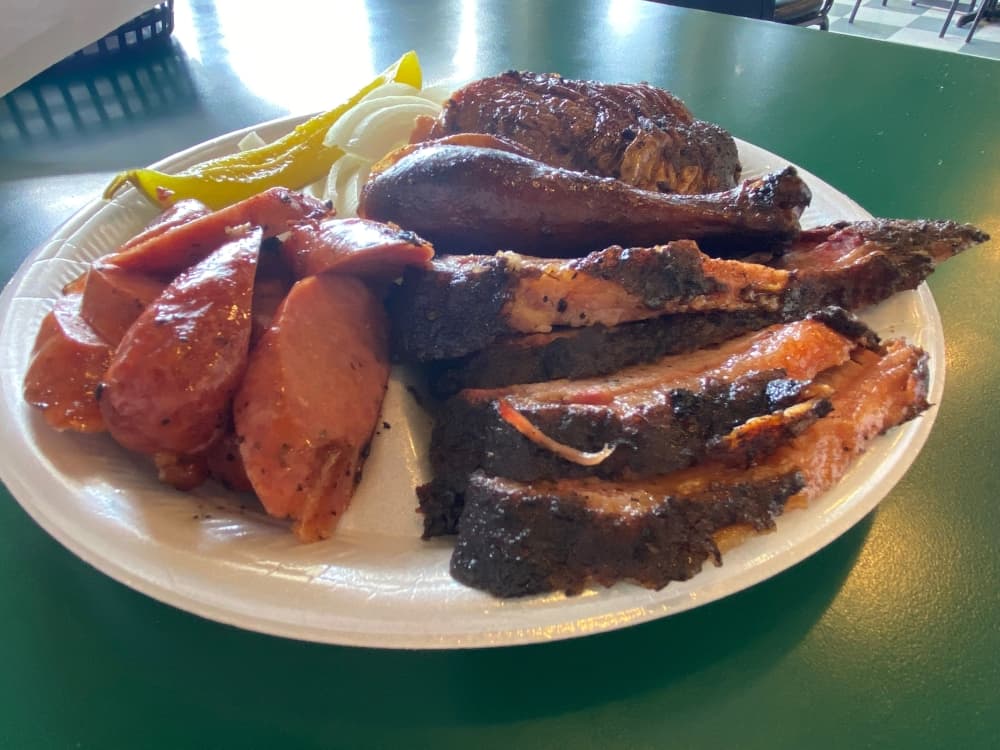 The three meat plate featuring brisket, chicken and sausage comes with two sides. $15.99 (Brooke Sjoberg/Community Impact Newspaper)
