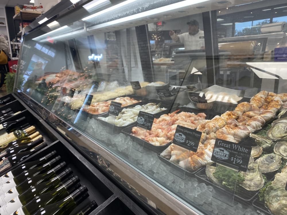 Seafood such as salmon, trout, oysters and shrimp are a staple at Flurry's Market + Provisions. Prices fluctuate with market value. (Samantha Douty/ Community Impact Newspaper)