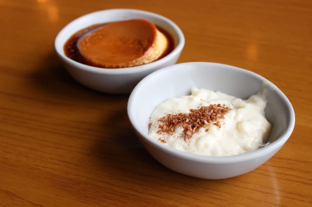 Sweet options at Ta'Bleyah include flan and rice pudding. (Andrew Christman/Community Impact Newspaper)