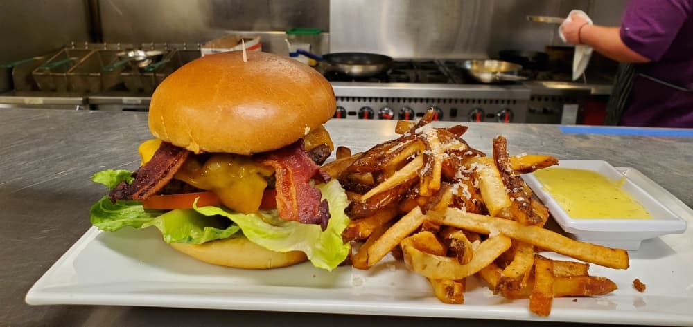 The burger and fries are a popular menu item at Westlake Wine bar.