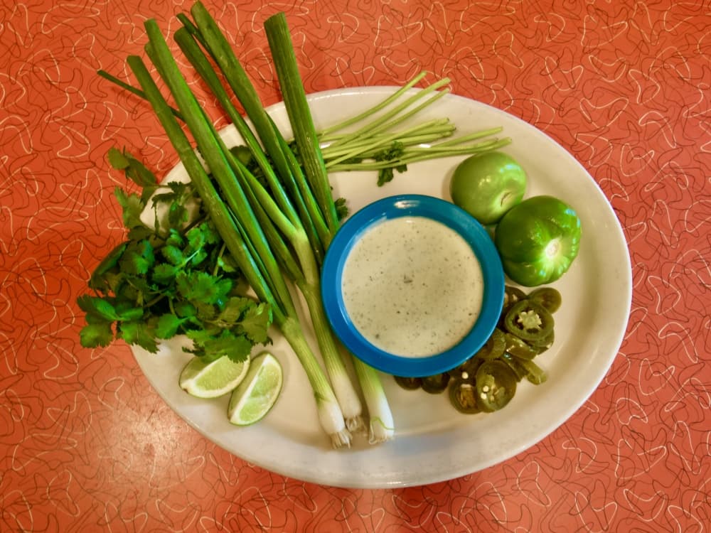 Chuy's creamy jalapeño dip and all of its fresh ingredients. (Glorie Martinez/Community Impact Newspaper staff)