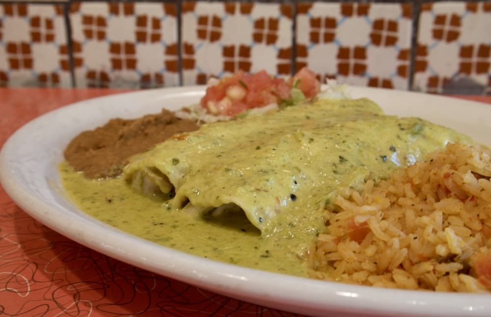
Chicka-Chicka Boom Boom Enchiladas are made with roasted chicken, cheese and Chuy’s signature hot sauce. 
(Photos by Glorie Martinez/Community Impact Newspaper)