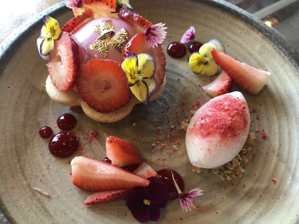 The colorful Ichigo tart ($16) is composed of strawberry mousse and compote, vanilla pastry ice cream, a black pepper sable cookie and milk sorbet. (Asia Armour/Community Impact Newspaper)