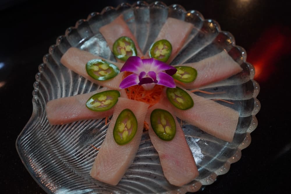 Yellowtail Jalapeno (nine pieces for $15.95) is served with ponzu sauce and green onion. (Christopher Goodwin/Community Impact Newspaper)