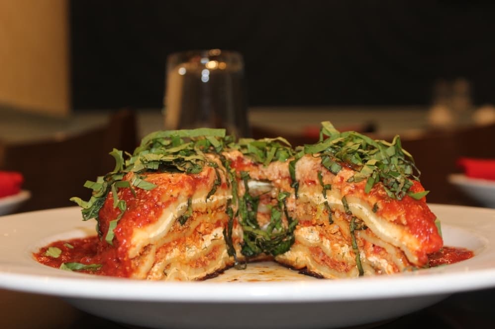 The 17 layer lasagna includes nine layers of pasta, three layers of ricotta, two layers of mozzarella, two layers of bolognese and one layer of sausage. ($19) (Claire Shoop/Community Impact Newspaper)