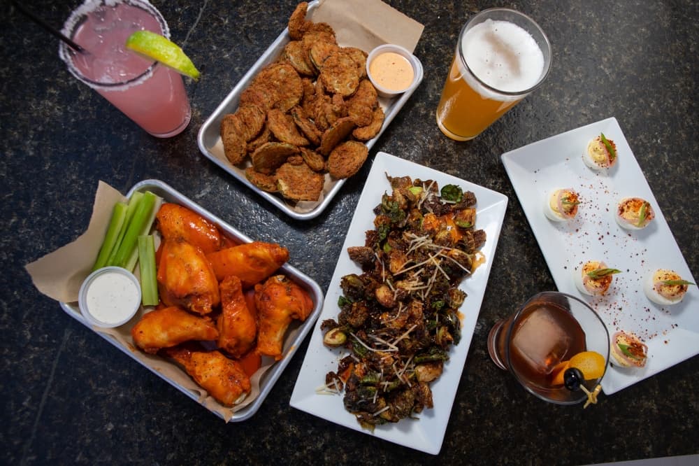 Deviled eggs, $8, brussels sprouts, $9.50, fried pickles, $9, eight bone-in wings, $13. (Courtesy Finley's Kitchen Bar)
