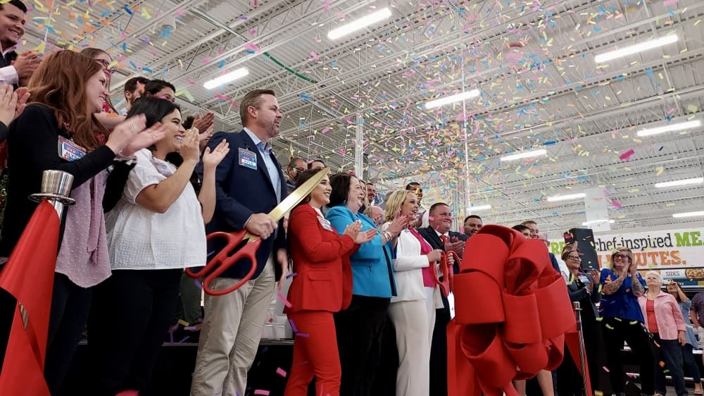 Representatives from H-E-B and local organizations attended a ribbon-cutting event April 28. (Lauren Canterberry/Community Impact Newspaper)
