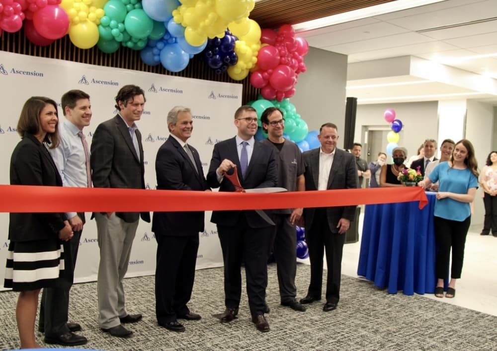 Steve Alder, mayor of Austin, cut the red ribbon with Andy Davis, President and CEO of Ascension Texas at the new health center grand opening at 1004 W. 32nd St., Austin, on April 27. The opening of the health center follows other expansions from Ascension Seton in Central Texas. (Sumaiya Malik/Community Impact Newspaper)
