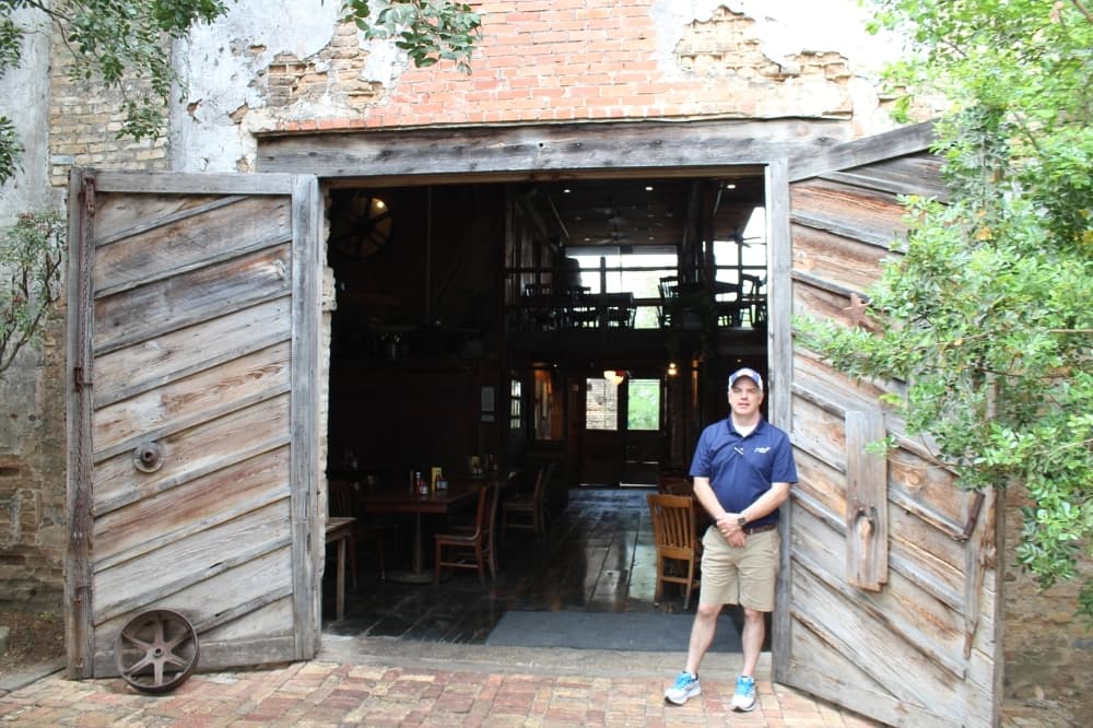 General Manager Larry Abel stands in front of the entrance to the Gristmill.