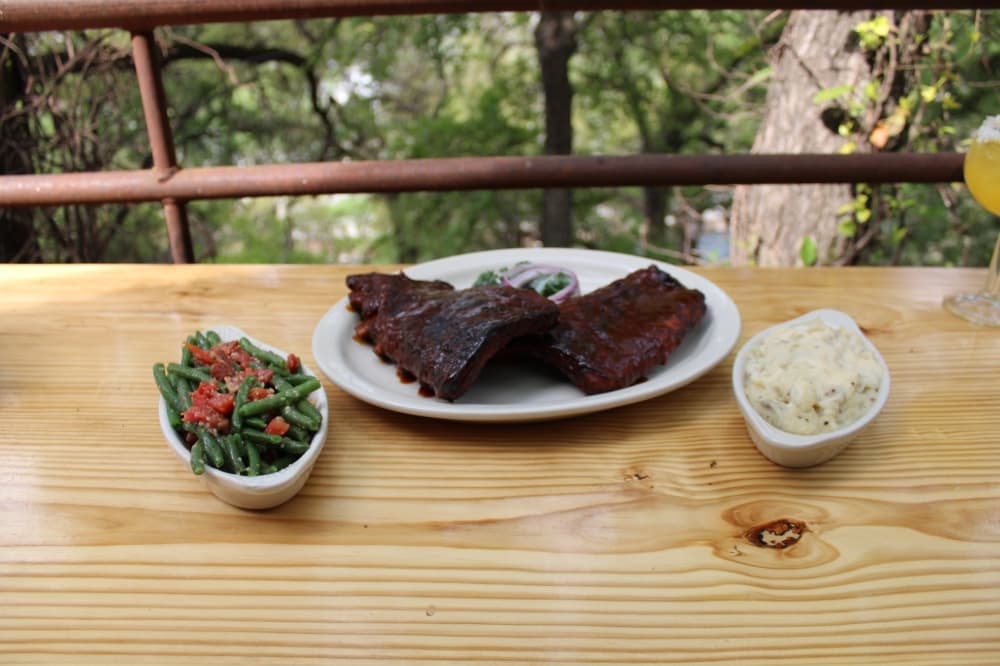 
The full rack of baby back ribs ($30.99) come with a choice of sides, such as the Gruene beans and homemade mashed potatoes.
