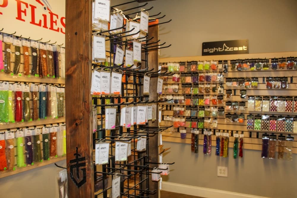 Grapevine Fly Fishing offers a wide variety of fly-tying materials, including beads, feathers, hooks and more, as well as Thomas & Thomas, Mystic, Risen and Taylor brand rods. (Bailey Lewis/Community Impact Newspaper)