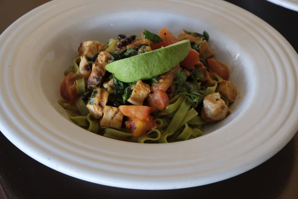 Peperoncino verde ($16): Jalapeño fettuccine is served with grilled chicken, tomato an, black beans, cilantro and avocado. (George Wiebe/Community Impact Newspaper)