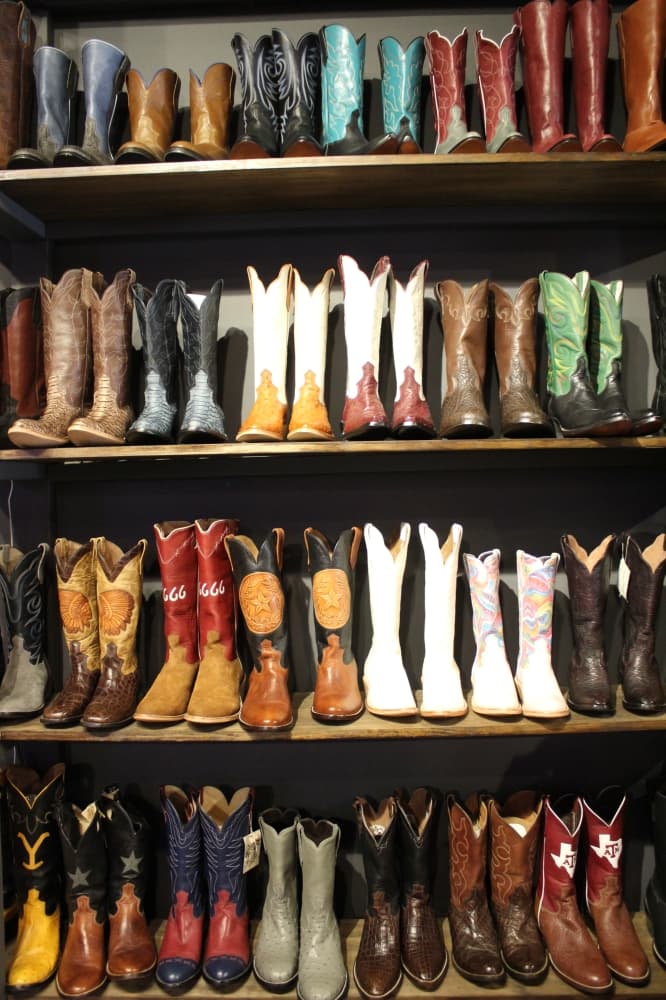 A selection of customer boots are on display at the 11th Street store. (Shawn Arrajj/Community Impact Newspaper)