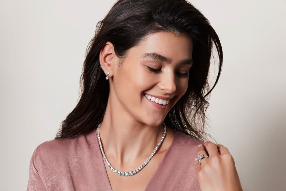 model wearing Clean origin necklace, ring, earrings