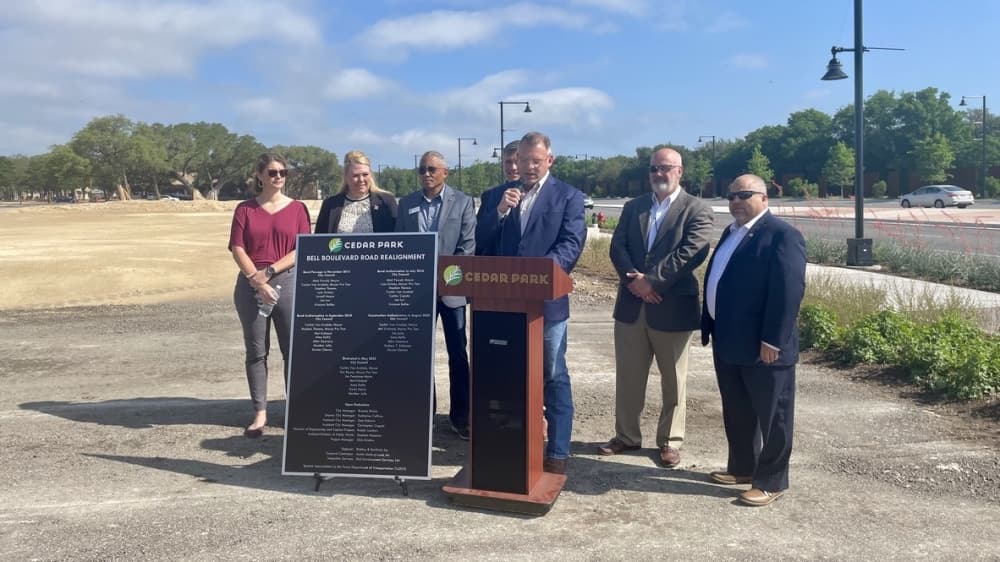 From left: Cedar Park City Council Members Heather Jefts, Anne Duffy, Kevin Harris, Jim Penniman-Morin, Mayor Corbin Van Arsdale, Eric Boyce and Mel Kirkland attend the ribbon cutting. (Claire Shoop/Community Impact Newspaper)