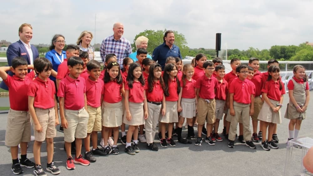 Second graders from the Momentous Institute are joined by AT&T Byron Nelson and city officials for the opening ceremony. (Miranda Jaimes/Community Impact Newspaper)