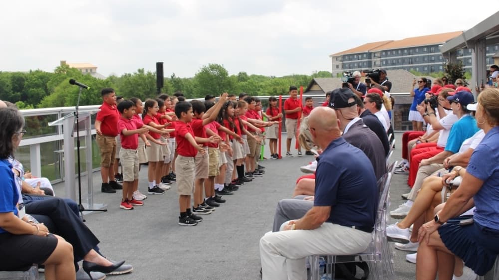 Second graders from the Momentous Institute performed a song for the AT&T Byron Nelson opening ceremony held May 10. (Miranda Jaimes/Community Impact Newspaper)