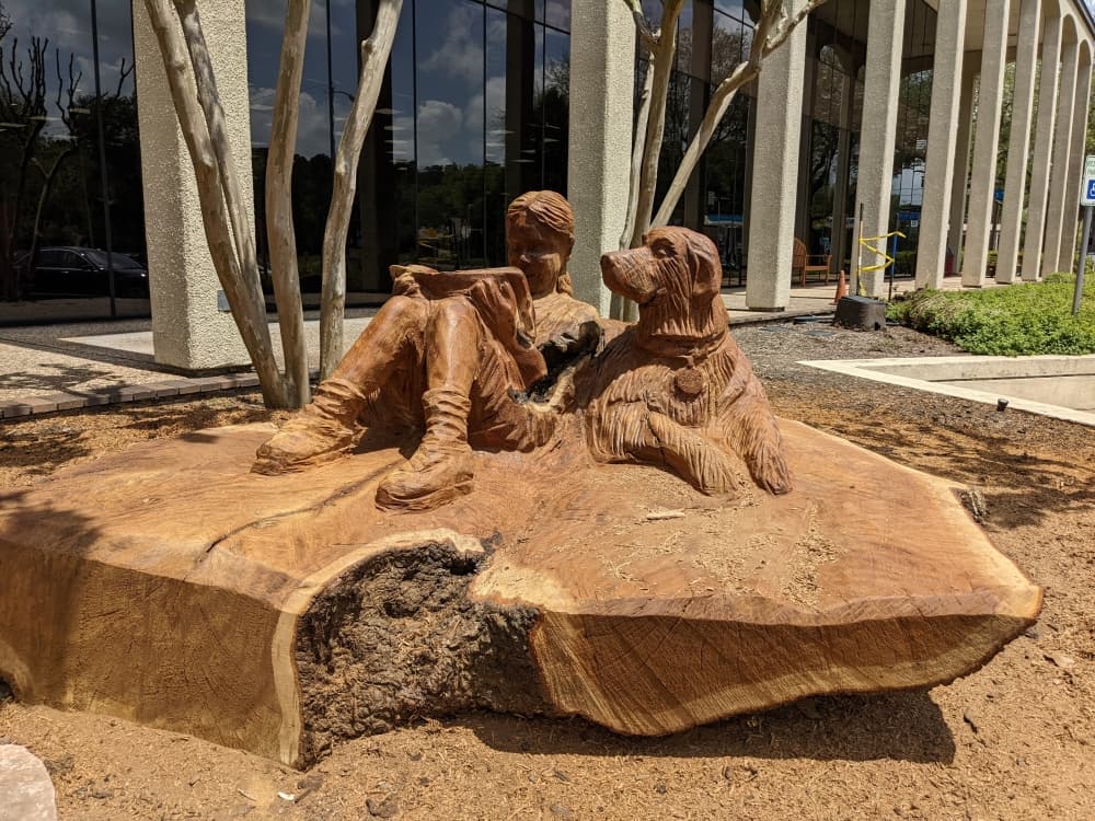 Phillips recently carved art for League City, including this piece outside Helen Hall Library. (Jake Magee/Community Impact Newspaper)
