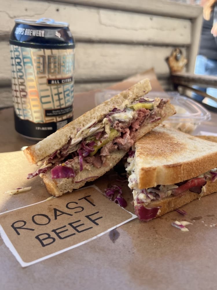 The Wagyu roast beef sandwich ($12) is made with beer cheese, pickles, honey mustard slaw and mustard aioli. (Courtesy Mallori Hanes)