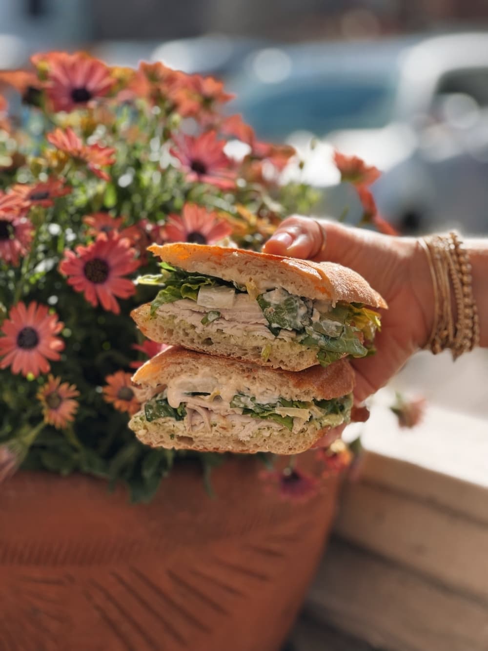 The roasted turkey breast sandwich ($11) is made with pesto aioli, romaine, pickled onions and Caesar dressing.