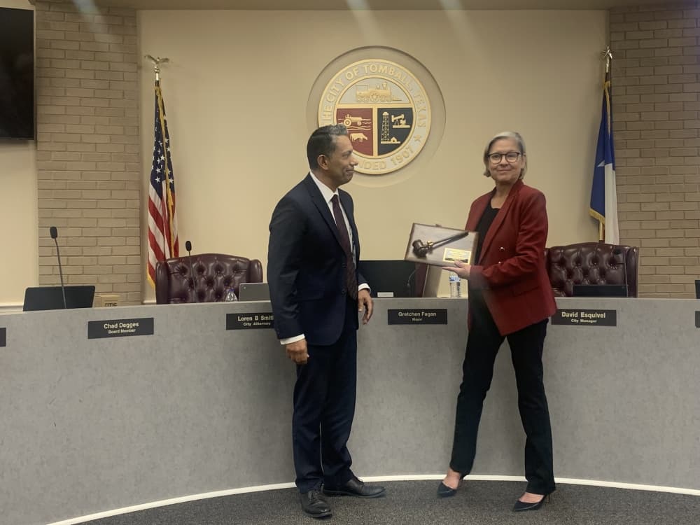 City Manager David Esquivel honored Gretchen Fagan at her last Tomball City Council meeting as mayor on May 16. (Kayli Thompson/Community Impact Newspaper)