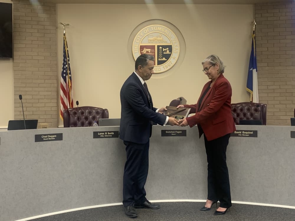 City Manager David Esquivel honored Gretchen Fagan at her last Tomball City Council meeting as mayor on May 16. (Kayli Thompson/Community Impact Newspaper)