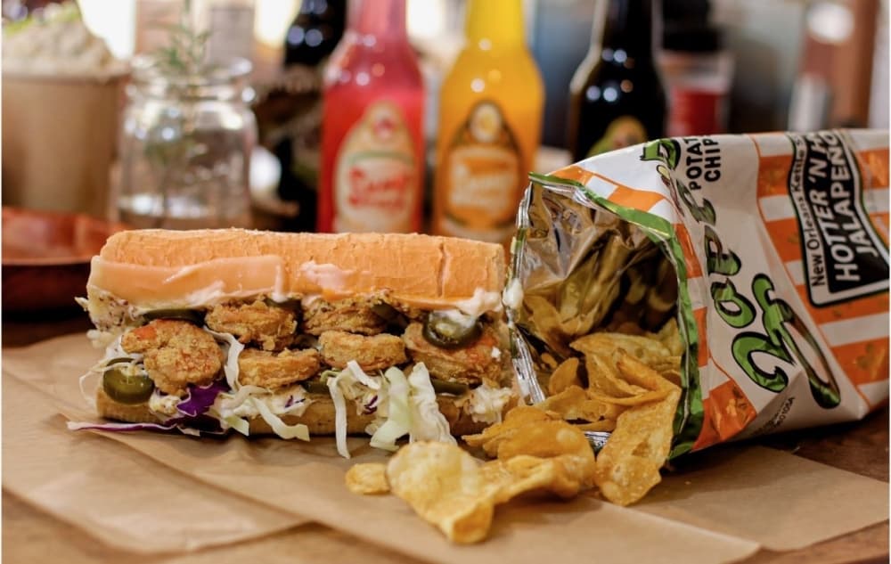 Fried shrimp po’boy ($18): French bread is stuffed with fried shrimp, cheese, coleslaw, jalapeno mayo and mustard and drizzled in sugar cane glaze. (Courtesy House of Roux)