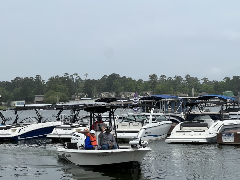 
Edwards operates a fishing guide business on Lake Conroe, helping clients catch fish and clean them.