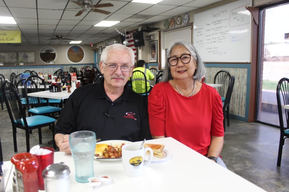 man and woman at table