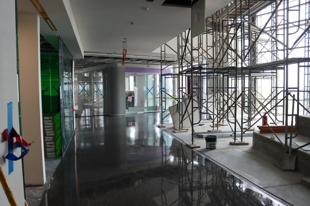 Classrooms and huddle spaces can be seen across recently polished floors at the Frisco Landing building. (Grant Johnson/Community Impact Newspaper)